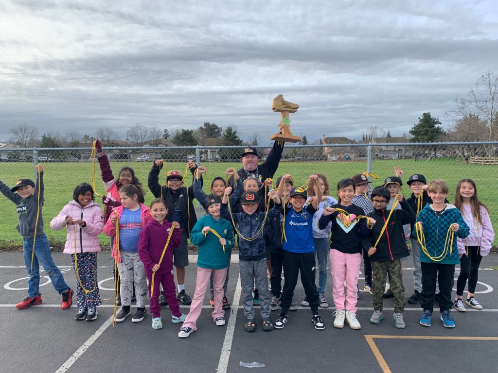 Image of students celebrating winning theGolden Sneaker Contest