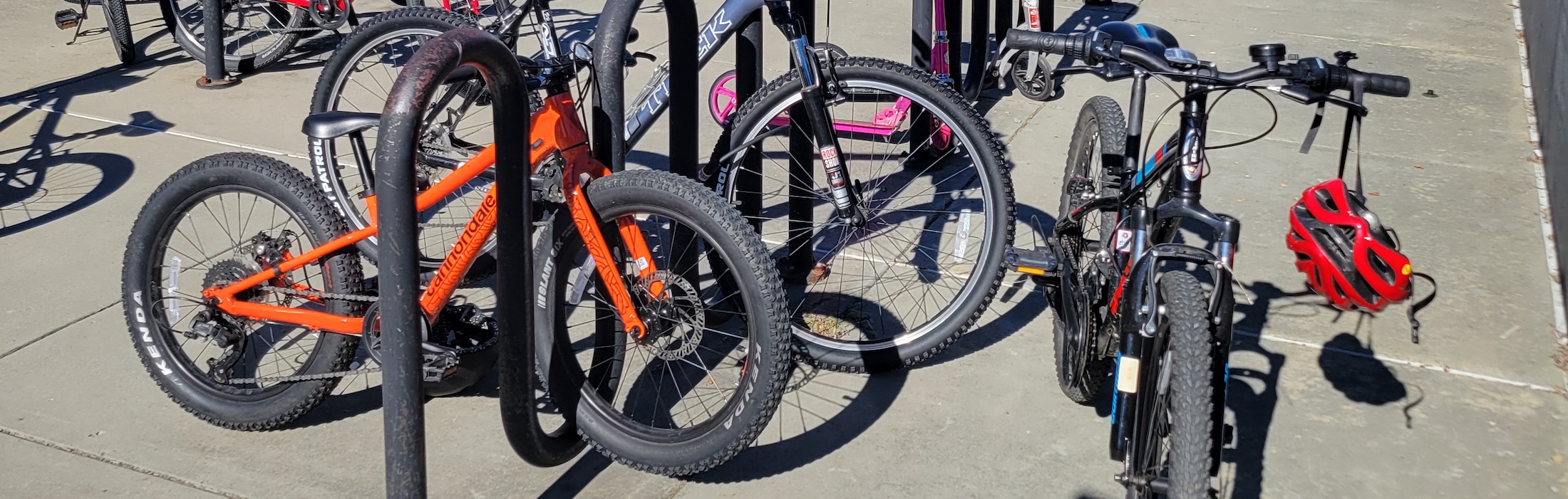 Photo of childrens bikes locked at a bike rack